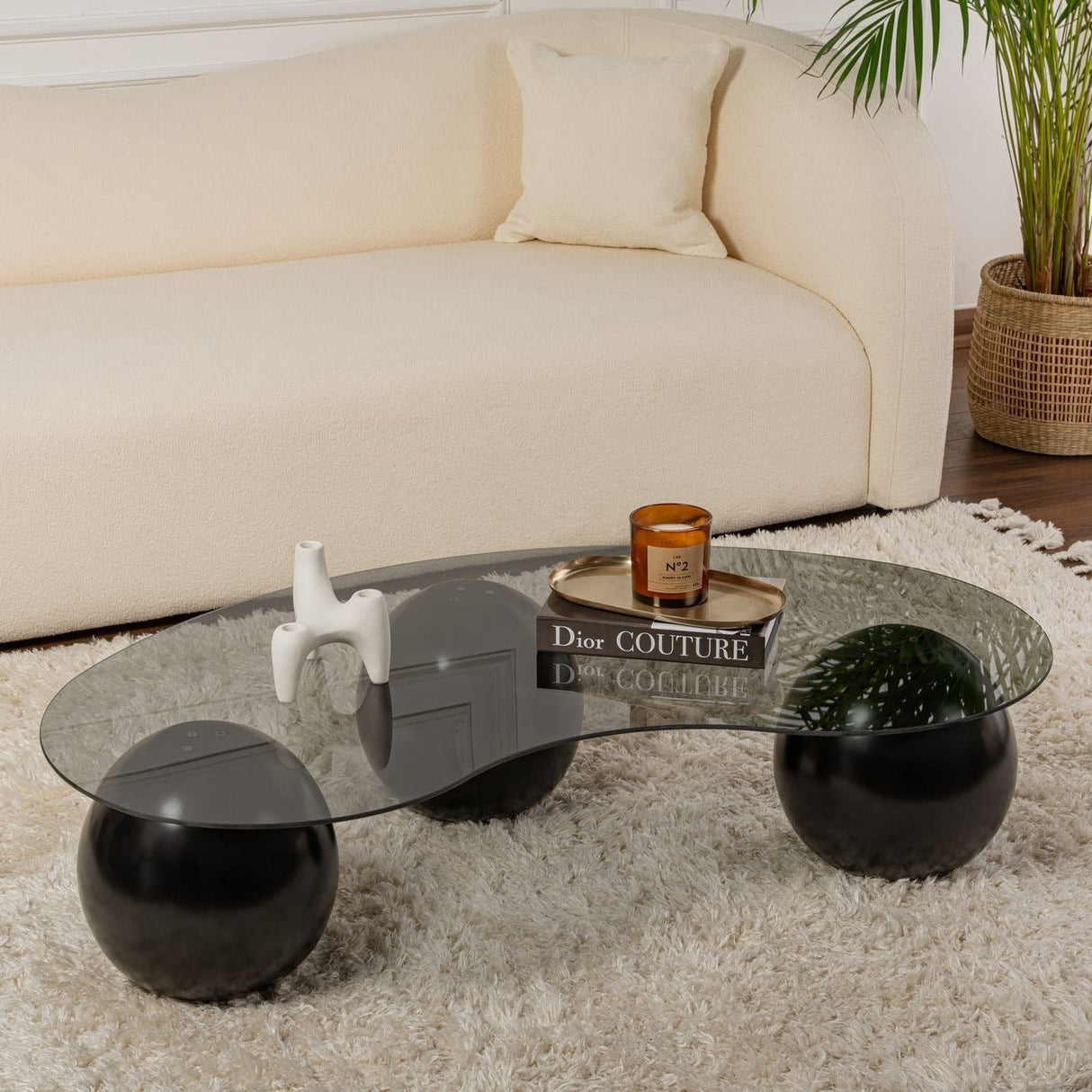 Organische salontafel grijs getint glas zwarte bolpoten Sphere 120x70 cm