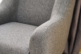 Sillón moderno de tela de lino gris con pata alta Revos