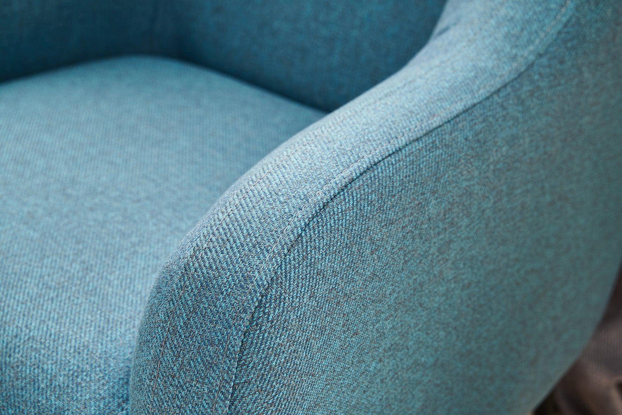 Sillón moderno tejido lino turquesa con pata alta Revos