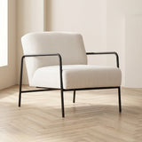 Sillón moderno Eti de tela blanca - Marco negro, foto atmosférica en un interior moderno