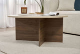 Mesa de centro redonda con tapa de travertino y base de madera oscura en forma de cruz.