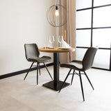 Mesa de comedor Mesa de bistro Redonda Dimehouse Marrón LxAnxAl 66x66x7 Madera de mango Configuración de esquina de vista frontal oblicua de fotografía atmosférica